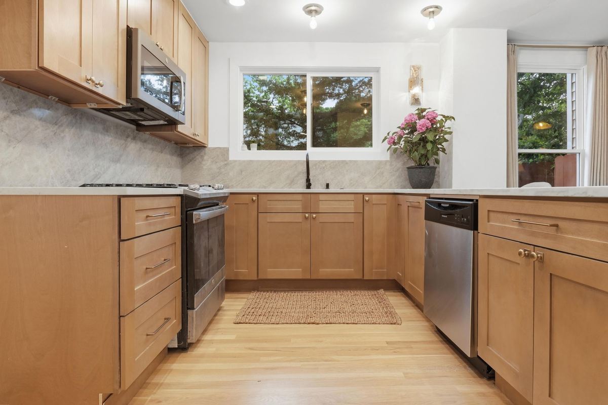 Kitchen with wood cabinets and a window over the sink